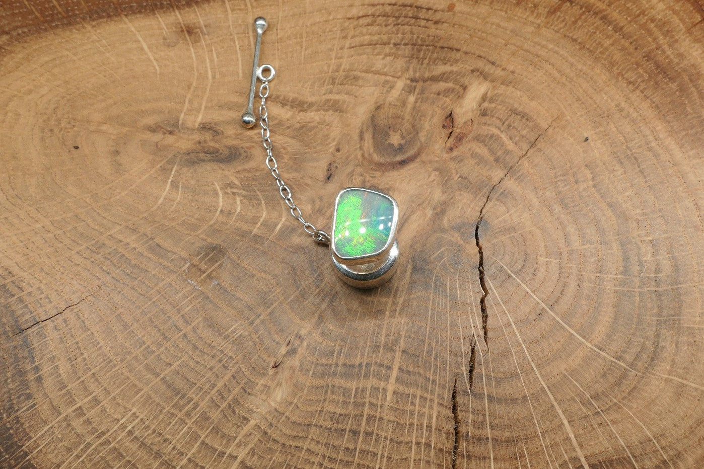 Silver tie tack with a Coober Pedy opal