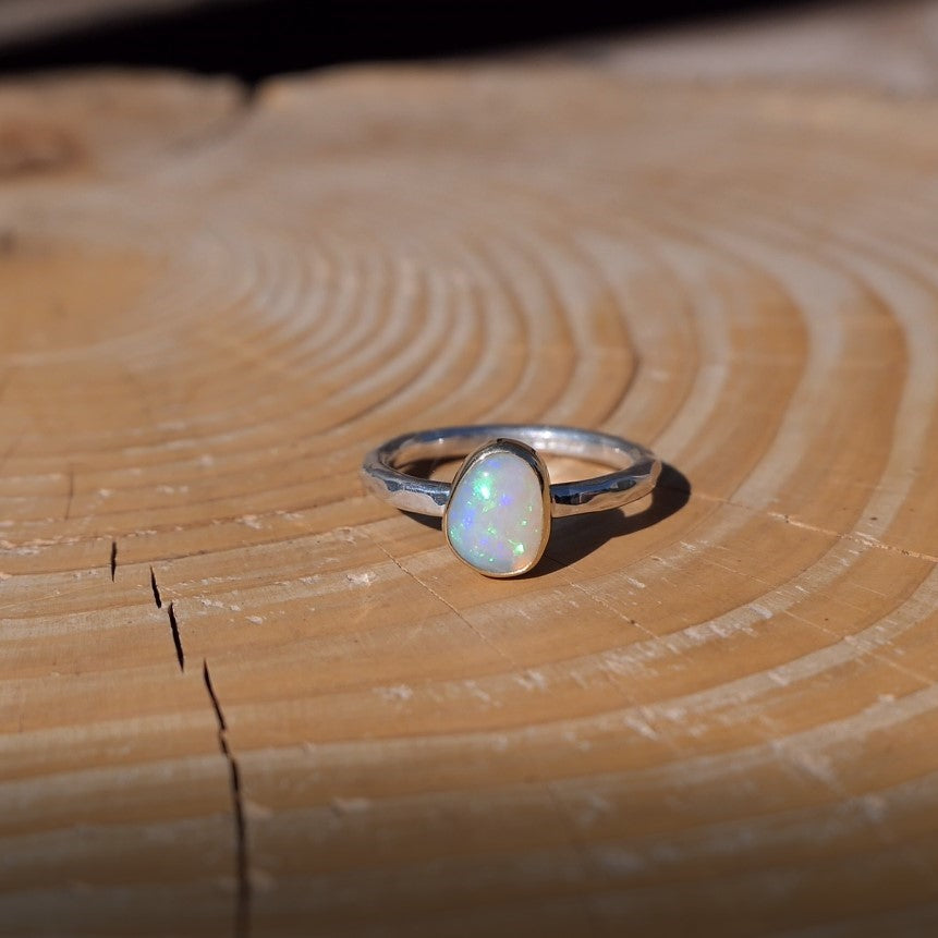 Lightning Ridge crystal opal ring with 18k gold bezel