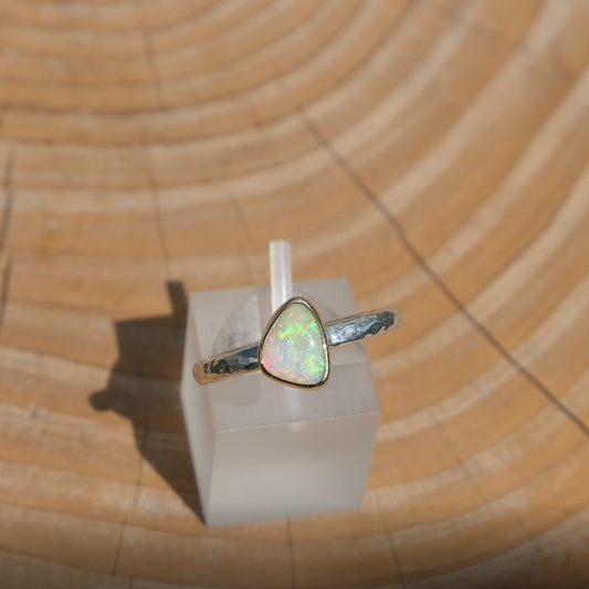 Lightning Ridge crystal opal ring, silver with an 18k gold bezel