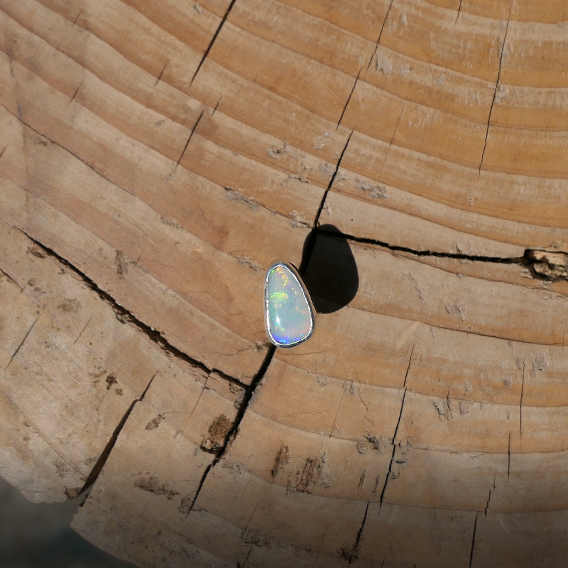 Silver tie tack with Coober Pedy solid opal.