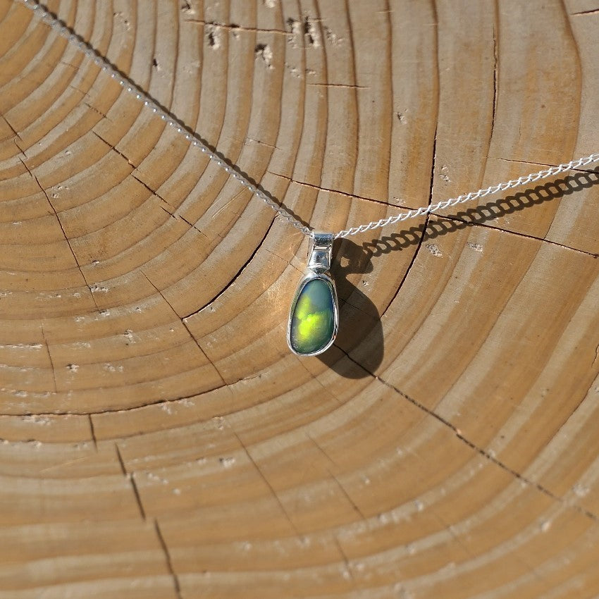 Silver pendant with a Coober Pedy doublet.