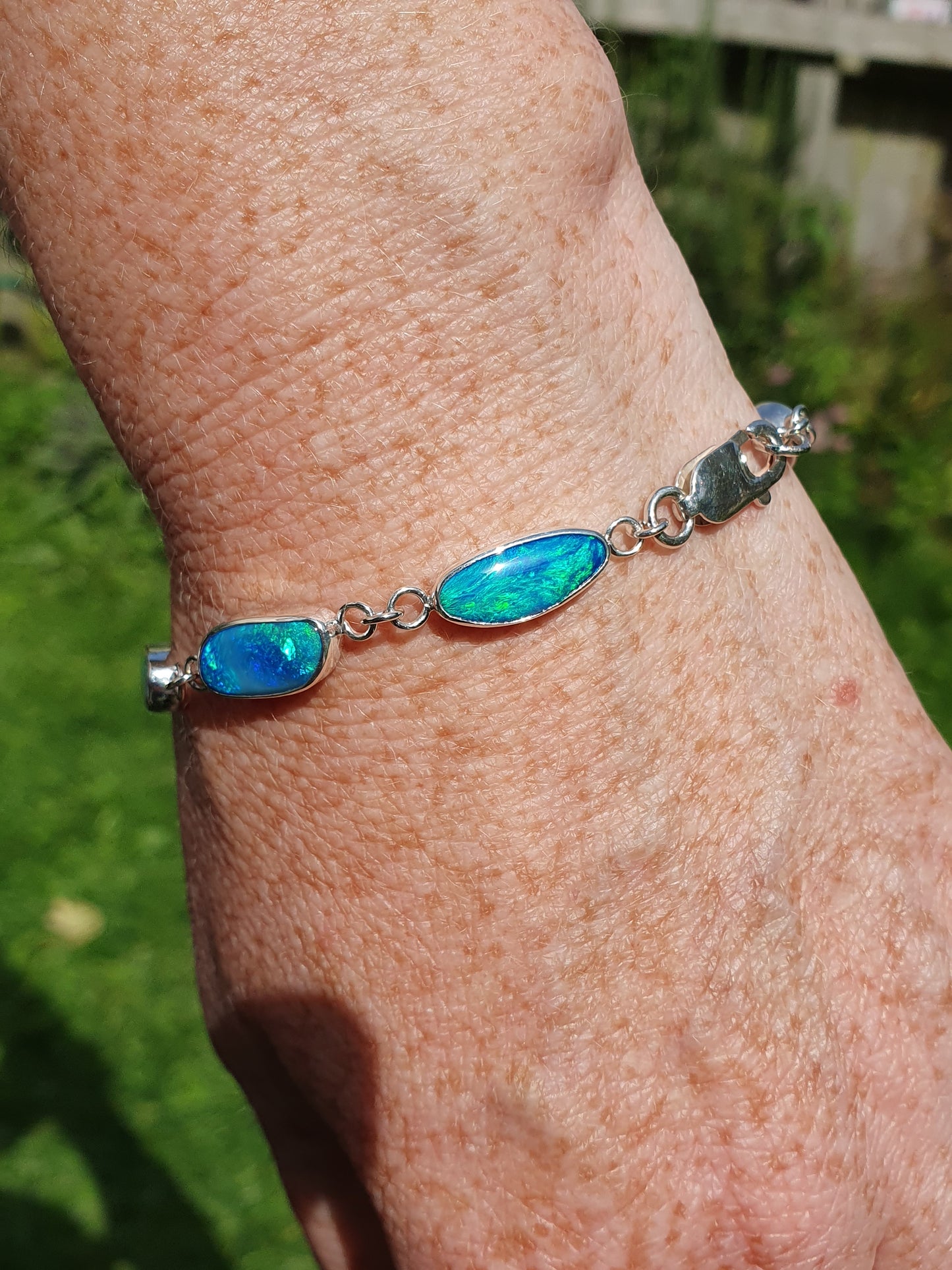 Silver opal bracelet, beautiful bright greens and blue opals