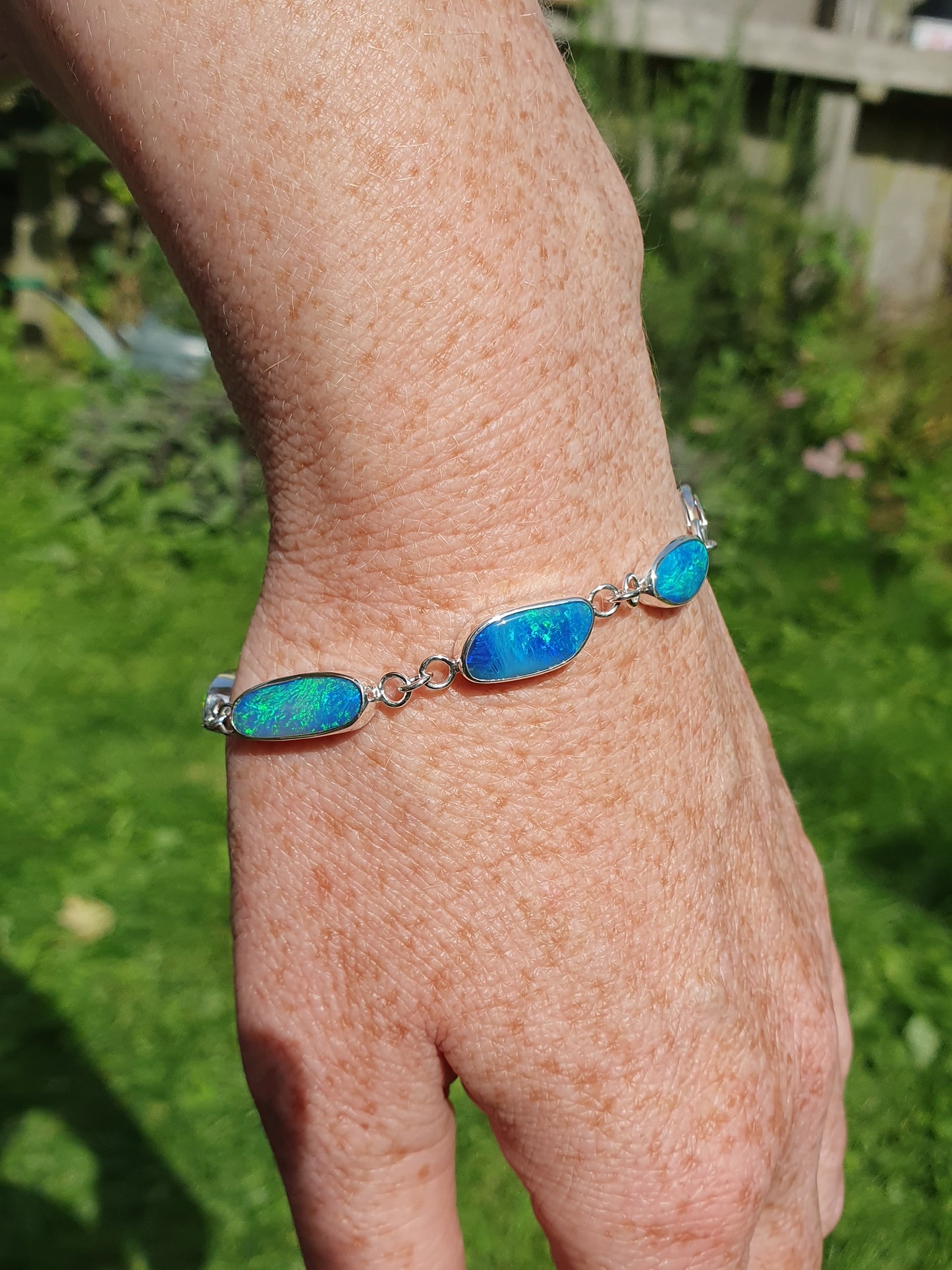 Silver opal bracelet, beautiful bright greens and blue opals