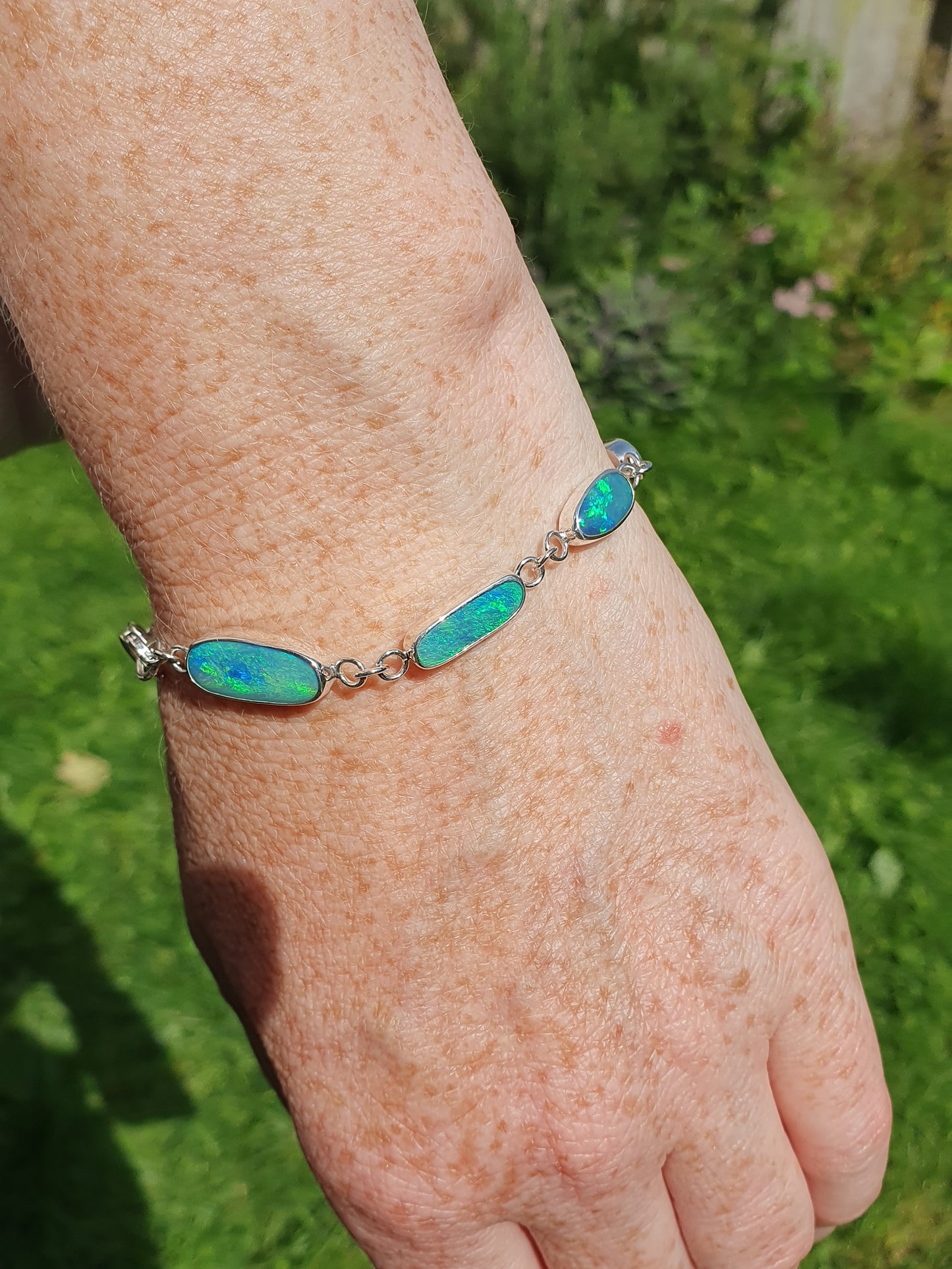 Silver opal bracelet, beautiful bright greens and blue opals