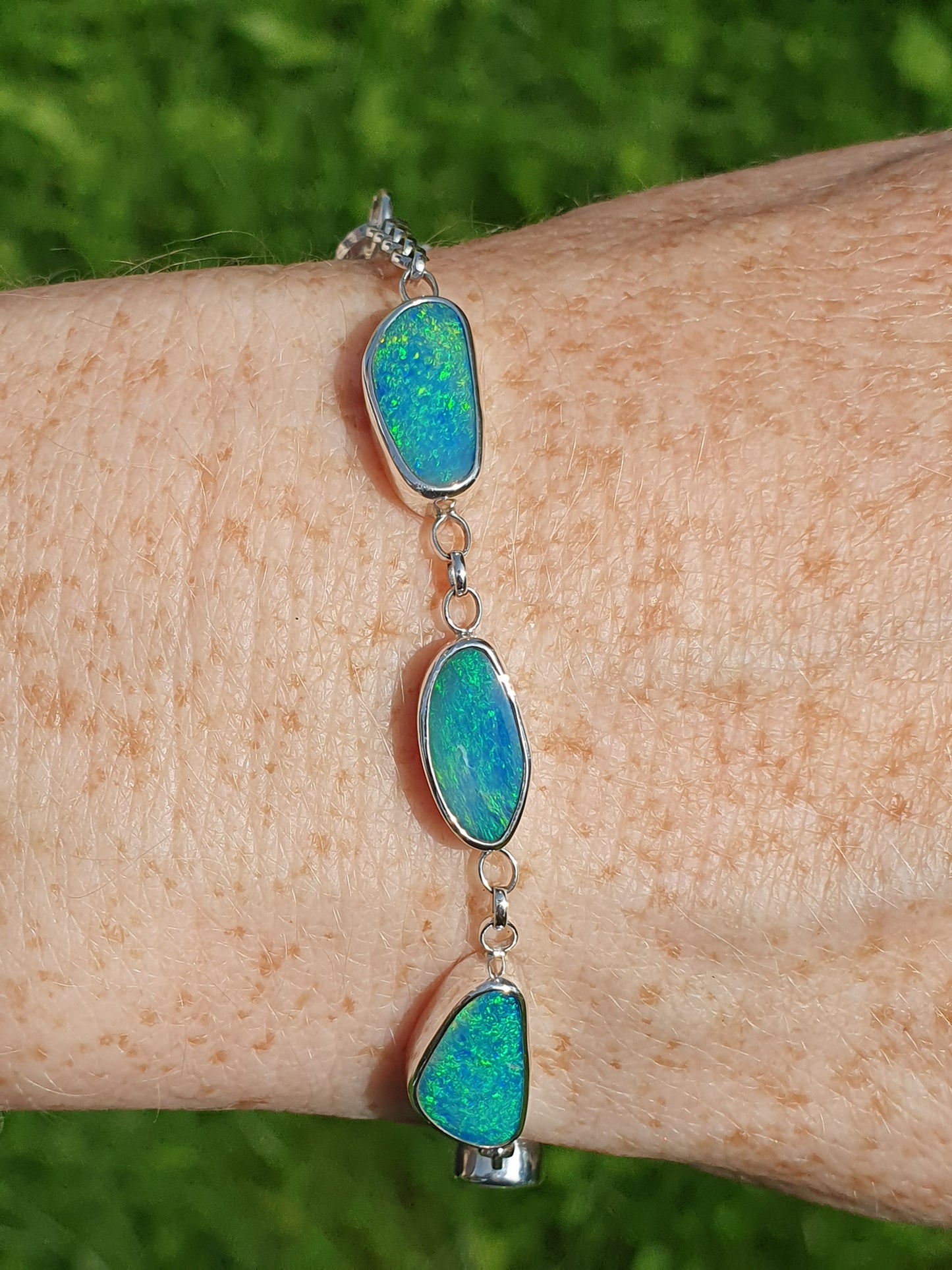 Silver opal bracelet, beautiful bright greens and blue opals