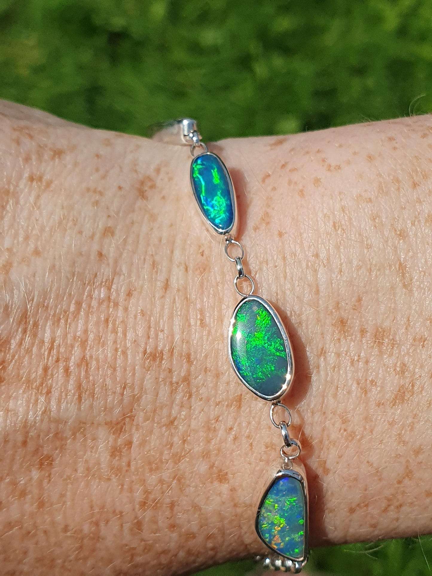 Silver opal bracelet, beautiful bright greens and blue opals