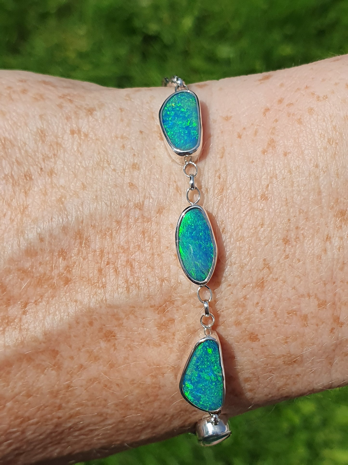 Silver opal bracelet, beautiful bright greens and blue opals