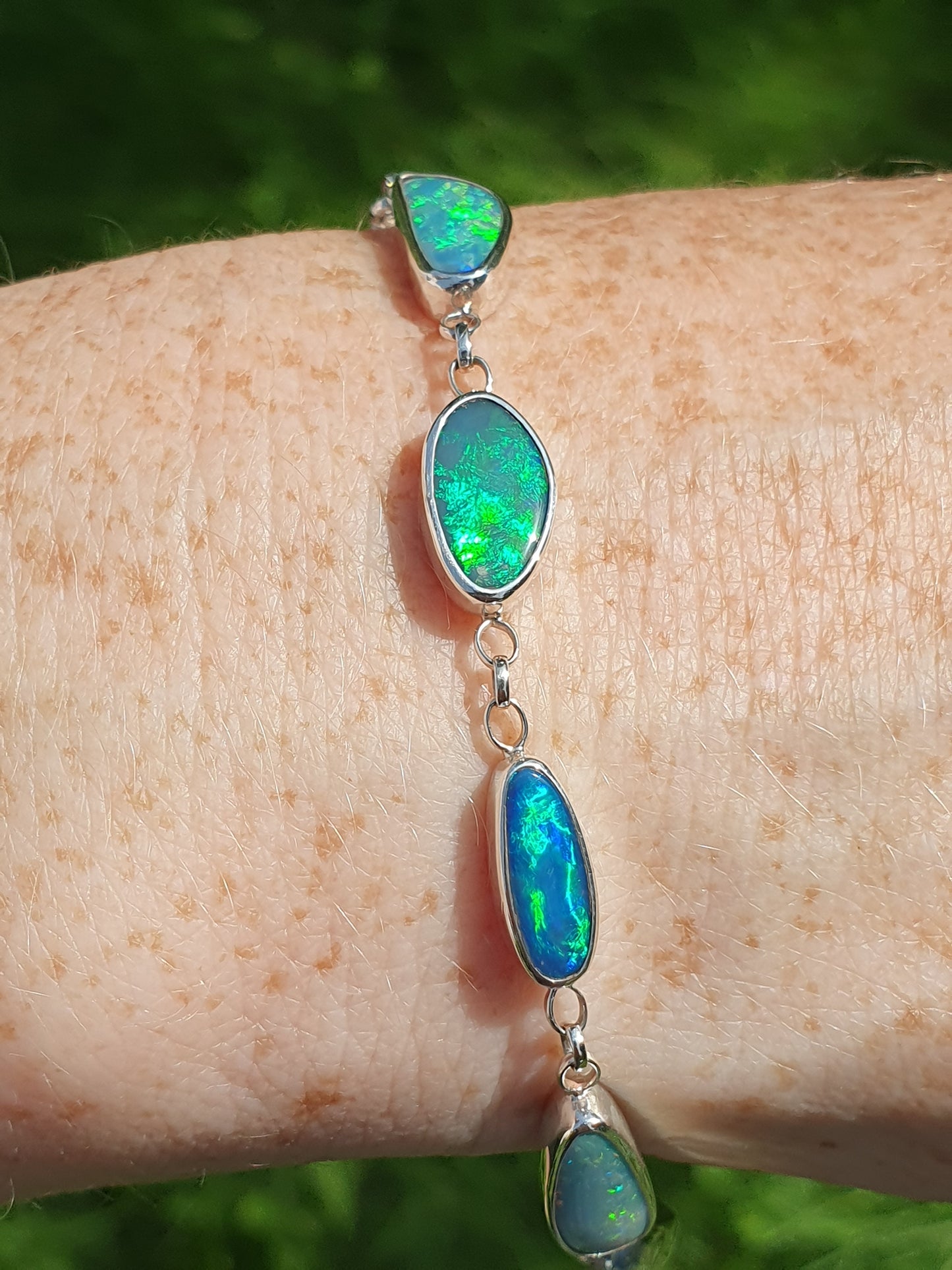 Silver opal bracelet, beautiful bright greens and blue opals