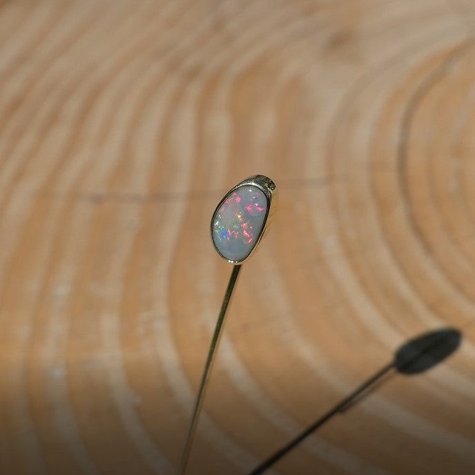 Lightning Ridge opal tie pin, opal is 0.75ct, measures 9x5mm, semi black n6 body tone, 4/5 brightness.