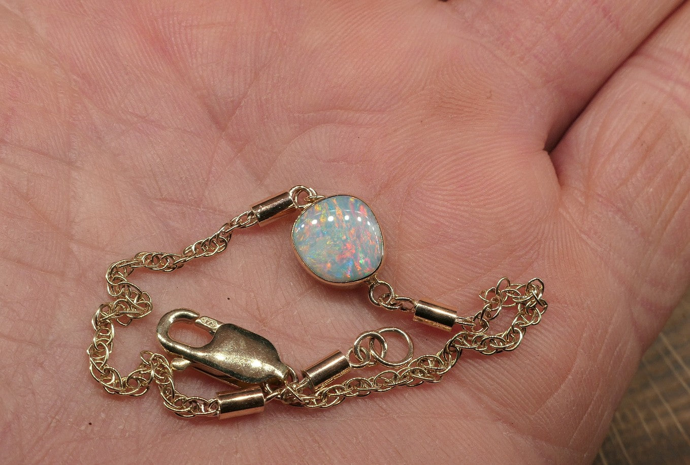 9k gold opal bracelet with a Mintubi solid opal.