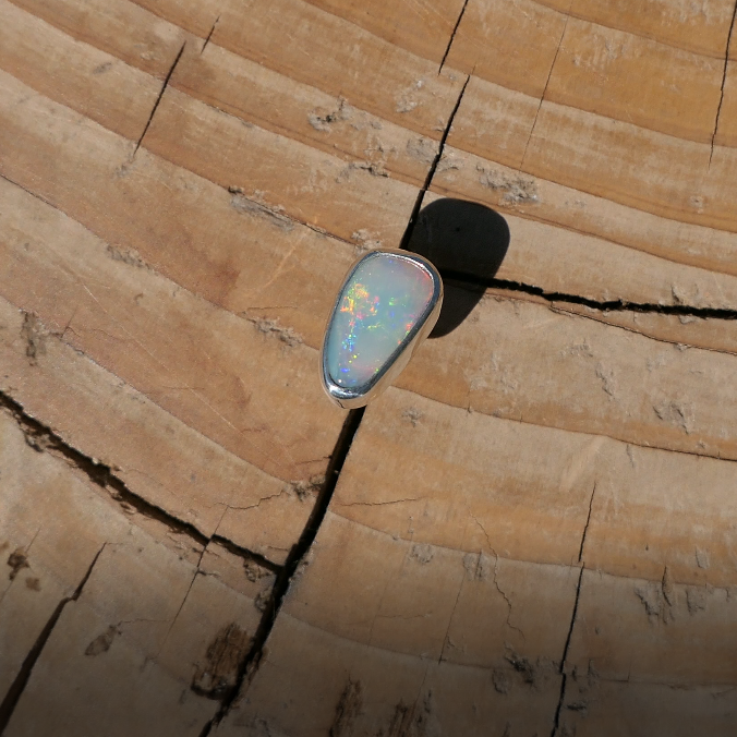 Silver tie tack with Coober Pedy solid opal.