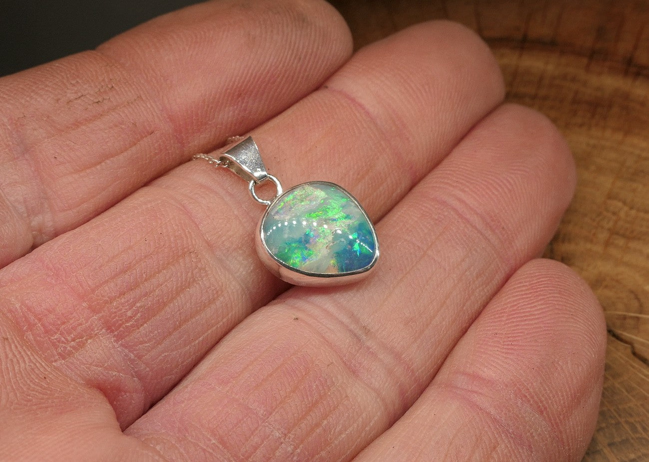 Opalised shell pendant