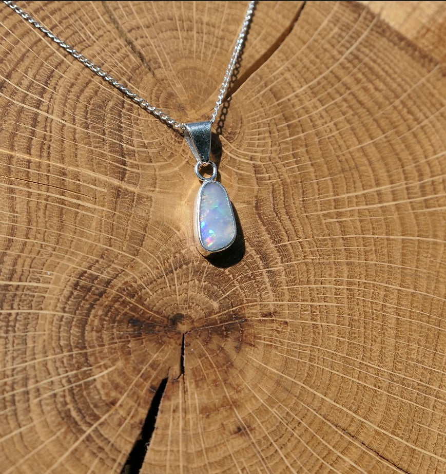Silver opal pendant with a Mintabie solid opal