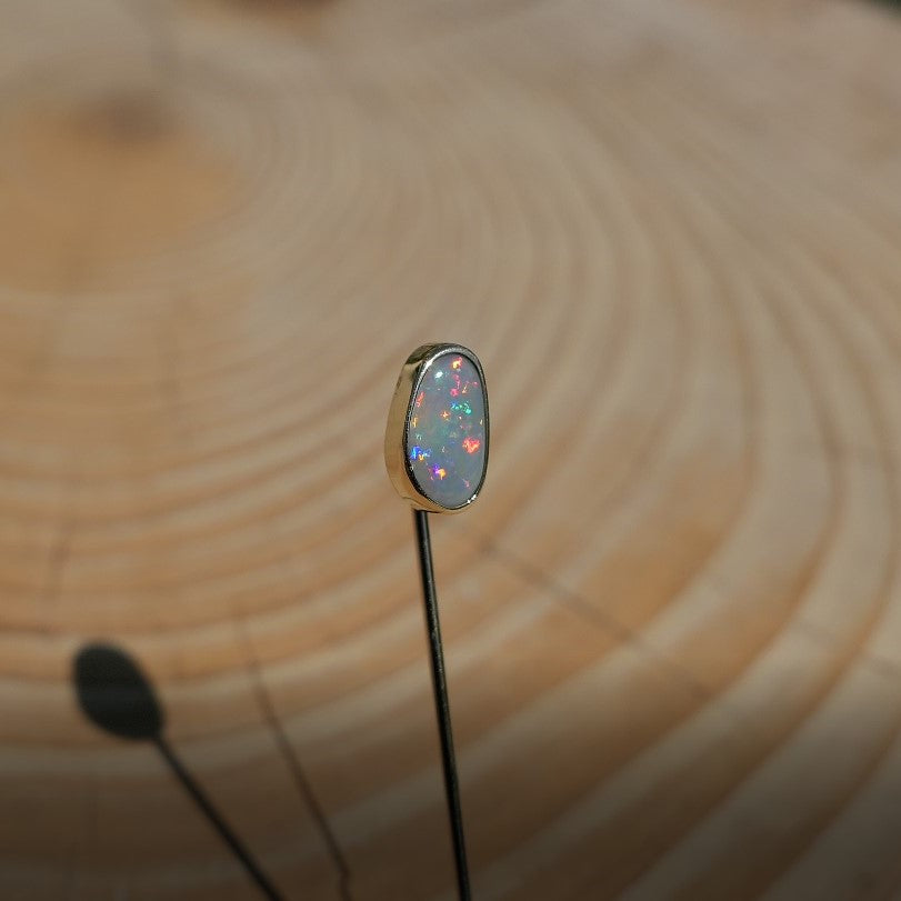 Lightning Ridge opal tie pin, opal is 0.75ct, measures 9x5mm, semi black n6 body tone, 4/5 brightness.