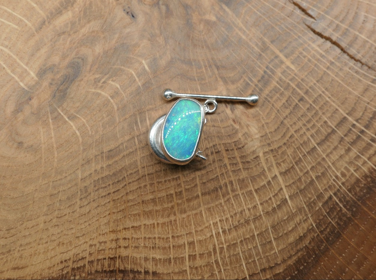 Silver tie tack with a Coober Pedy opal