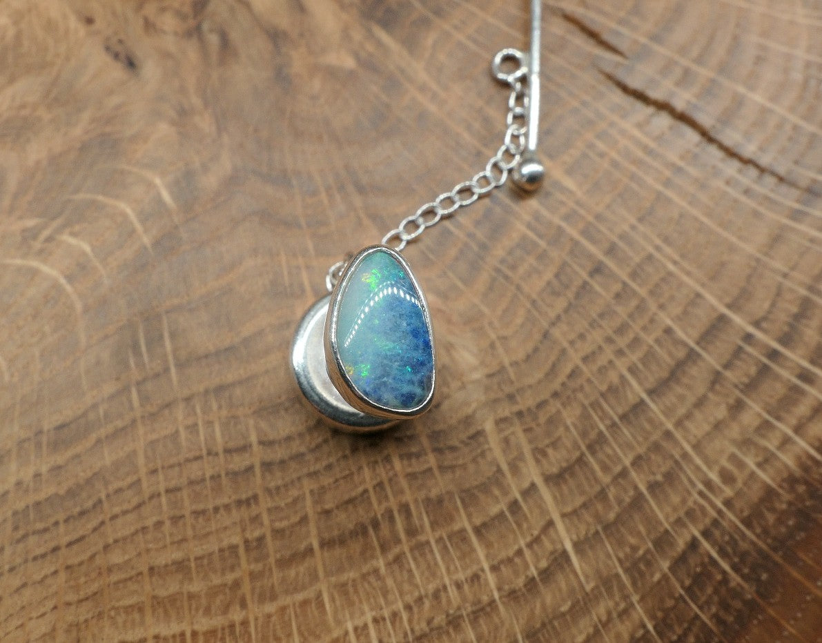 Silver tie tack with an opalised shell doublet