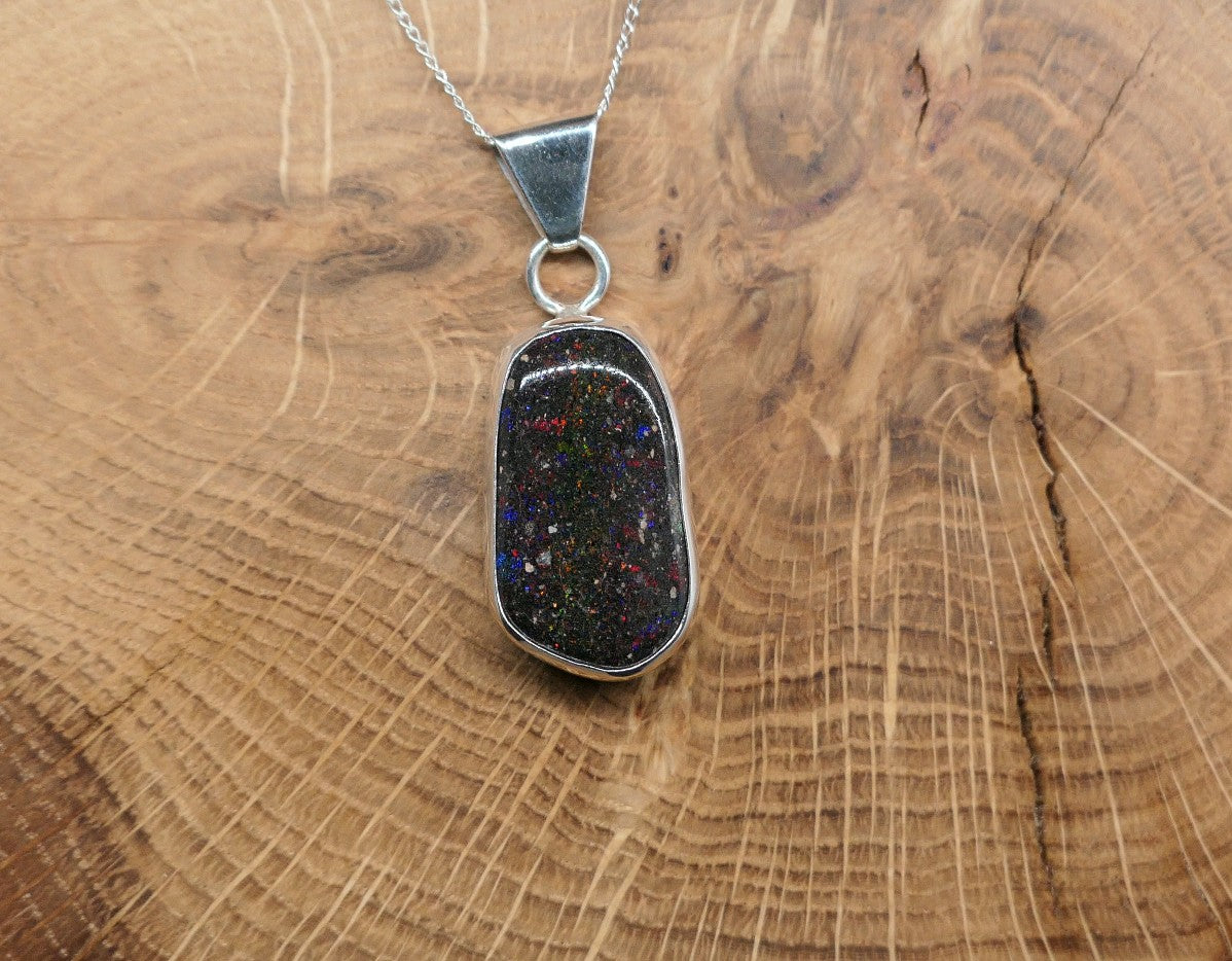 Silver opal pendant with a Honduran matrix opal