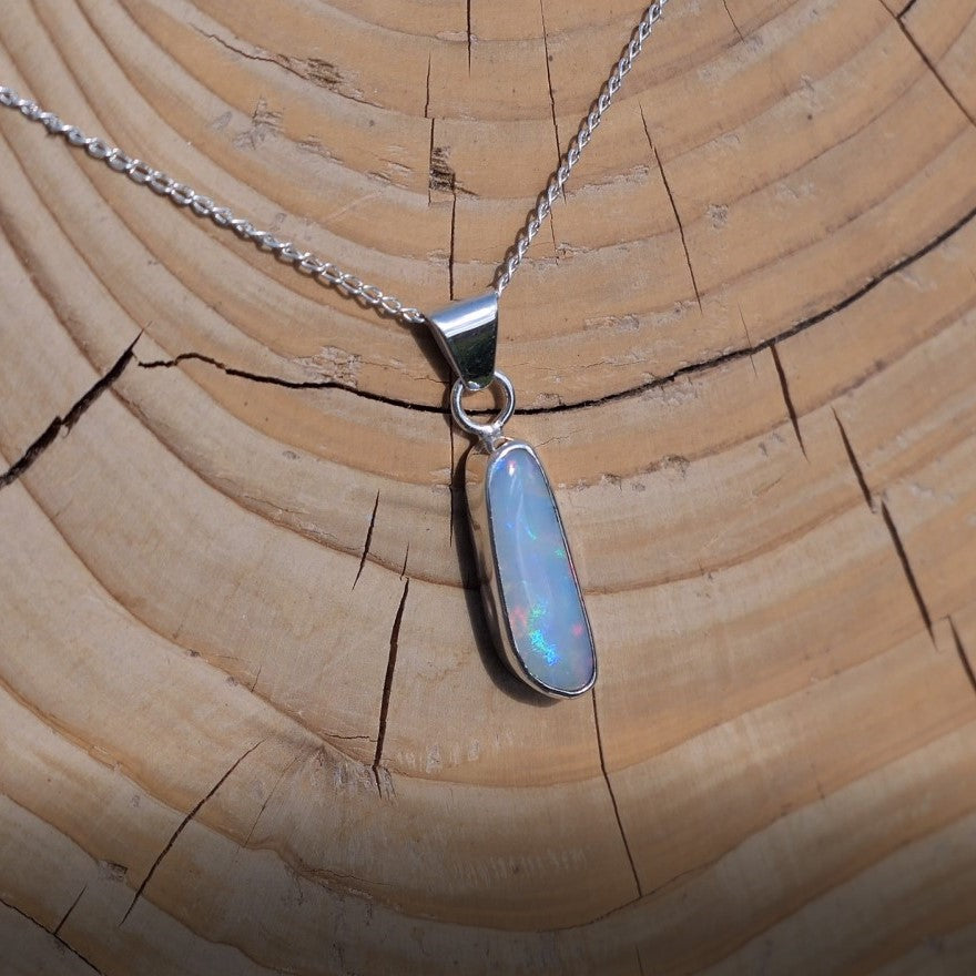 Silver pendant with white base Coober Pedy opal.