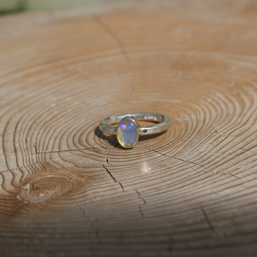 Silver opal ring with 18k gold bezel