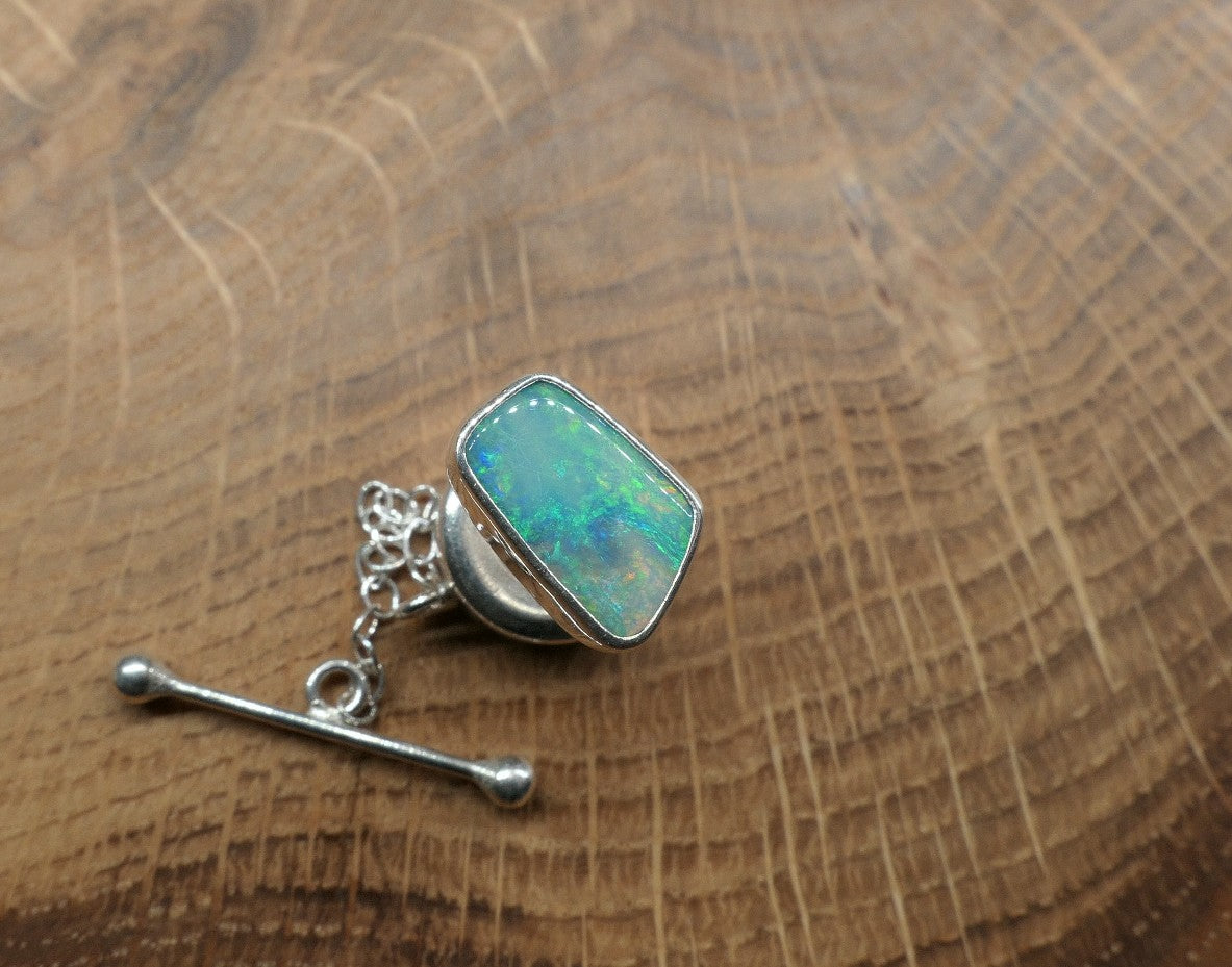 Silver tie tack with a Coober Pedy opal