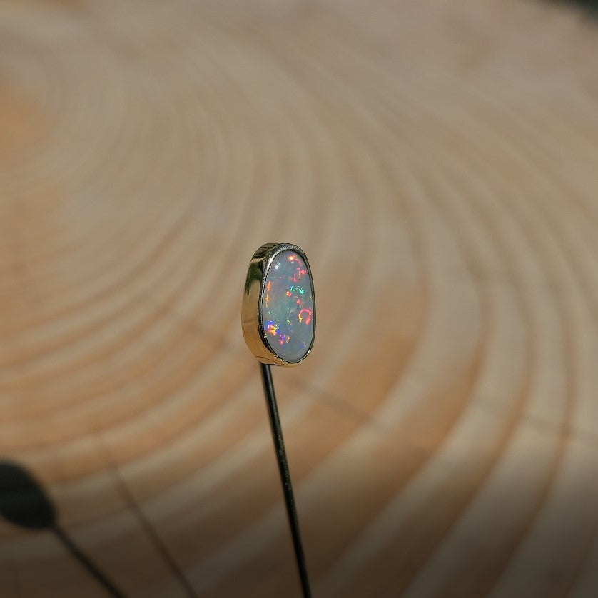 Lightning Ridge opal tie pin, opal is 0.75ct, measures 9x5mm, semi black n6 body tone, 4/5 brightness.