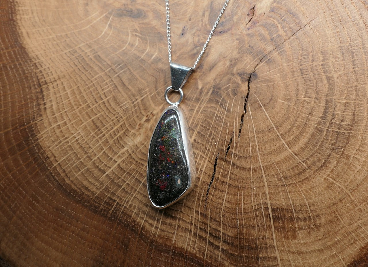Silver opal pendant with a Honduran matrix opal