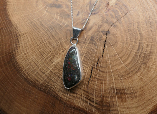 Silver opal pendant with a Honduran matrix opal