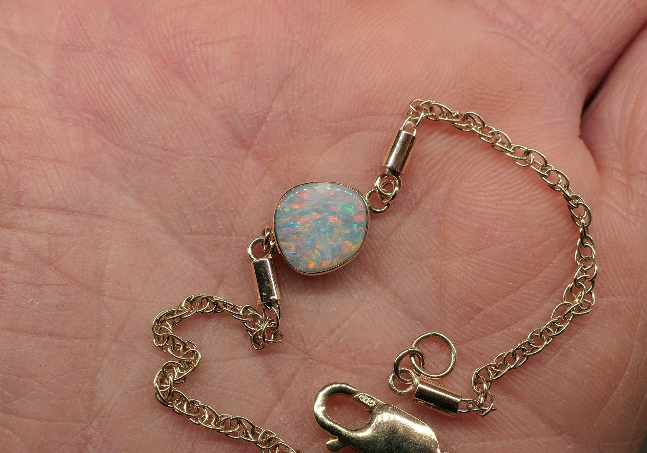 9k gold opal bracelet with a Mintubi solid opal.