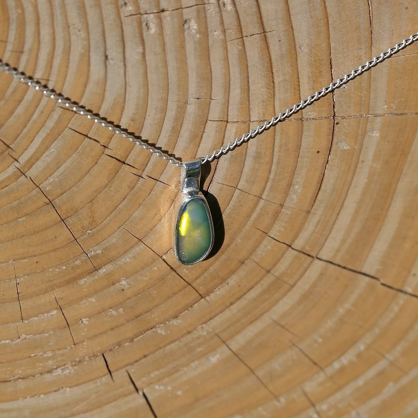 Silver pendant with a Coober Pedy doublet.