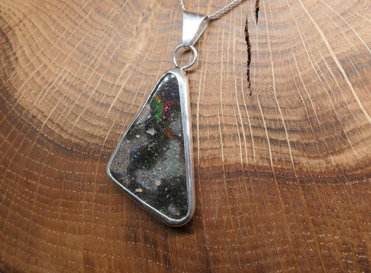 Double sided silver pendant with a Honduran matrix opal