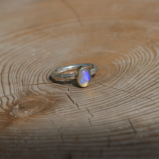 Silver opal ring with 18k gold bezel