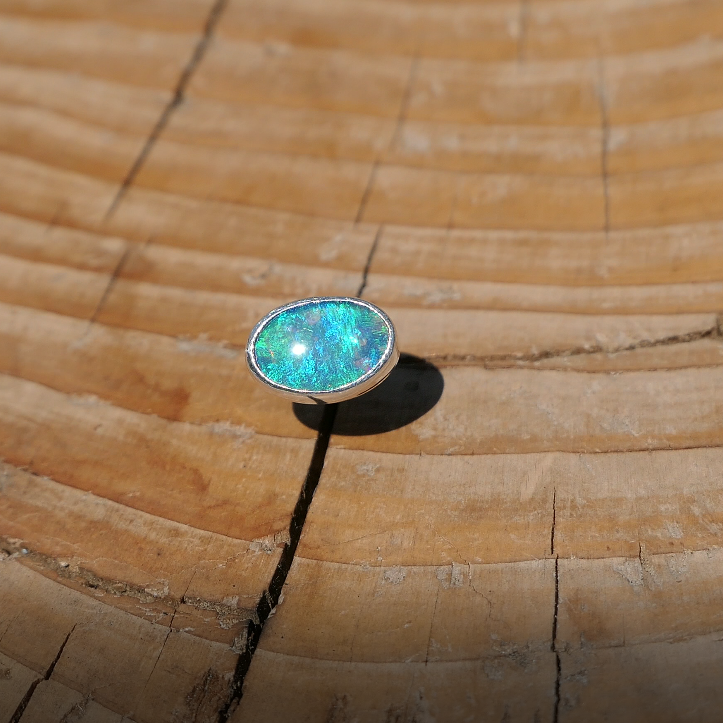 Silver tie tack with Coober Pedy opal.