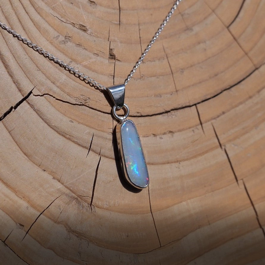 Silver pendant with white base Coober Pedy opal.