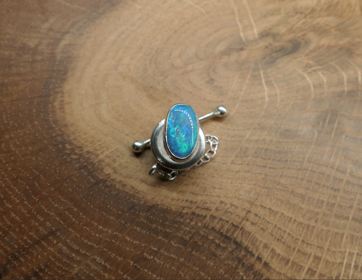 Silver tie tack with a Coober Pedy opal