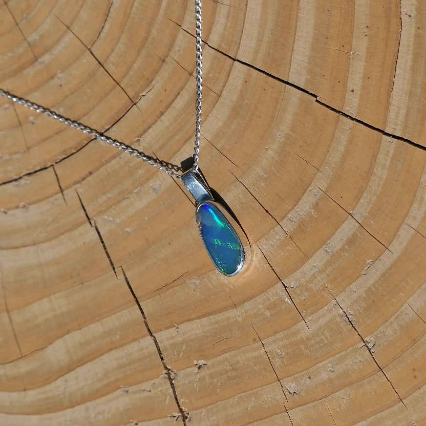 Silver pendant with a Coober Pedy doublet.