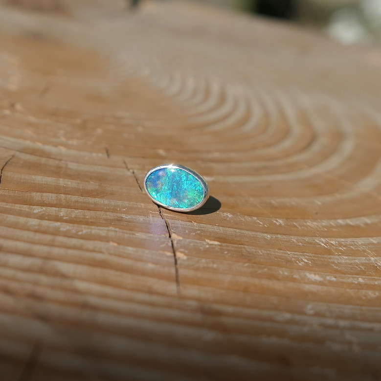 Silver tie tack with Coober Pedy opal.