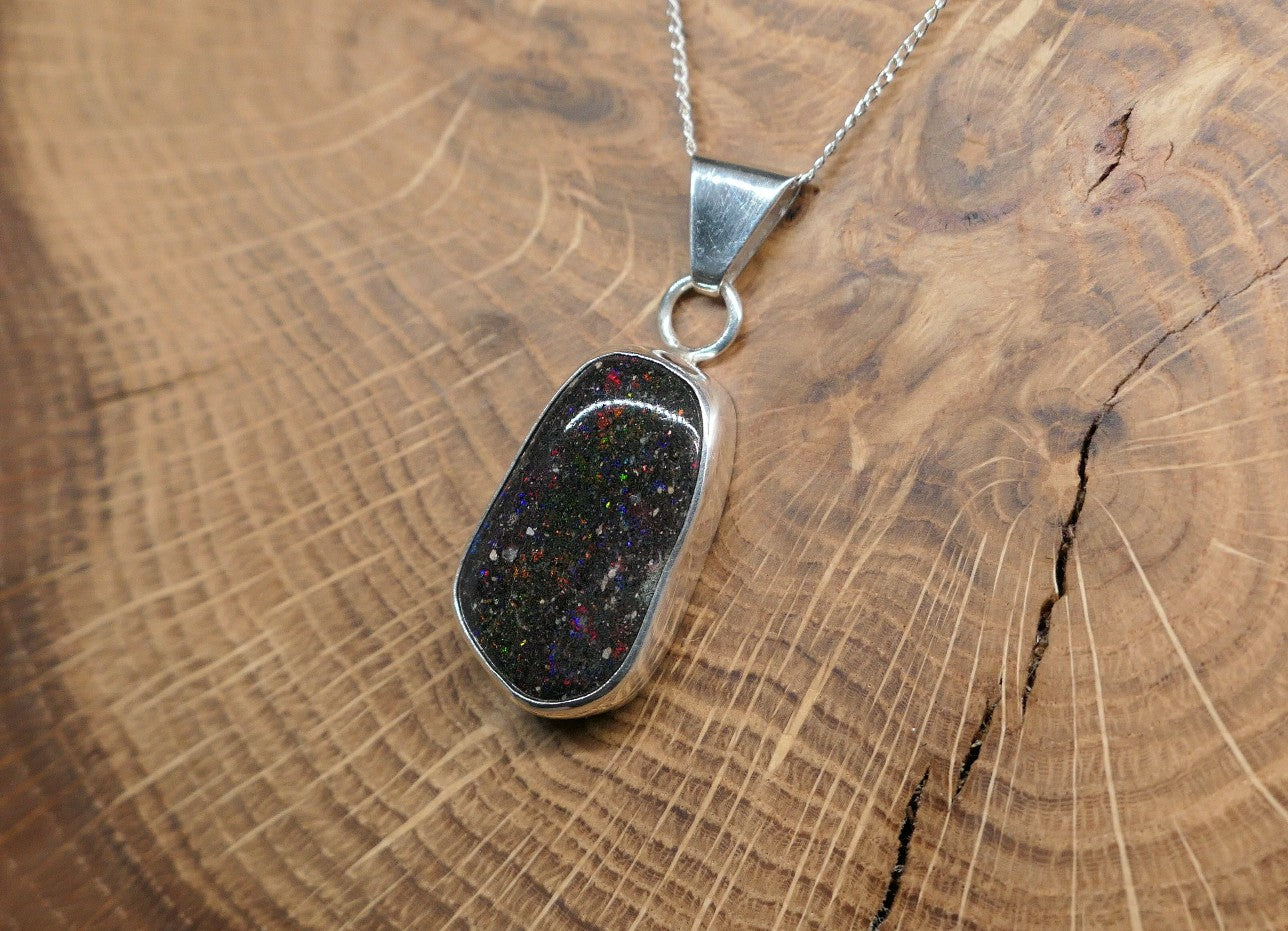Silver opal pendant with a Honduran matrix opal