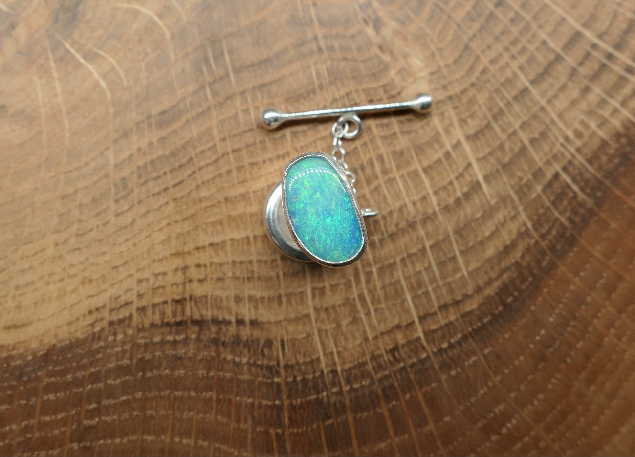 Silver tie tack with a Coober Pedy opal