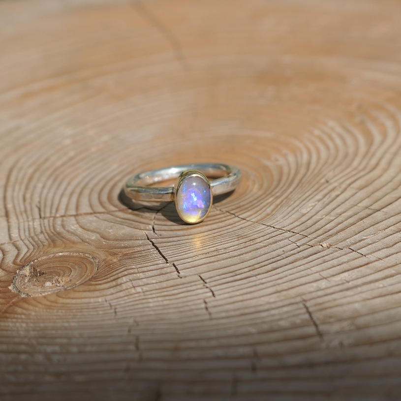 Silver opal ring with 18k gold bezel