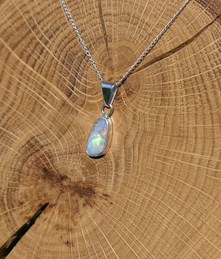Silver opal pendant with a Mintabie solid opal