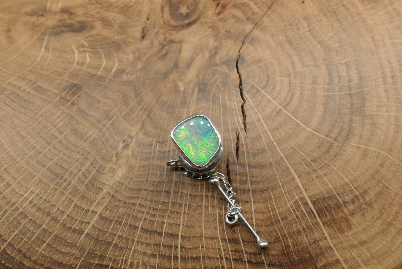 Silver tie tack with a Coober Pedy opal