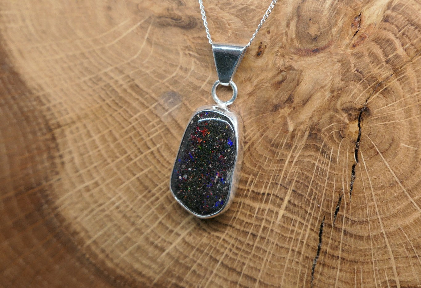 Silver opal pendant with a Honduran matrix opal