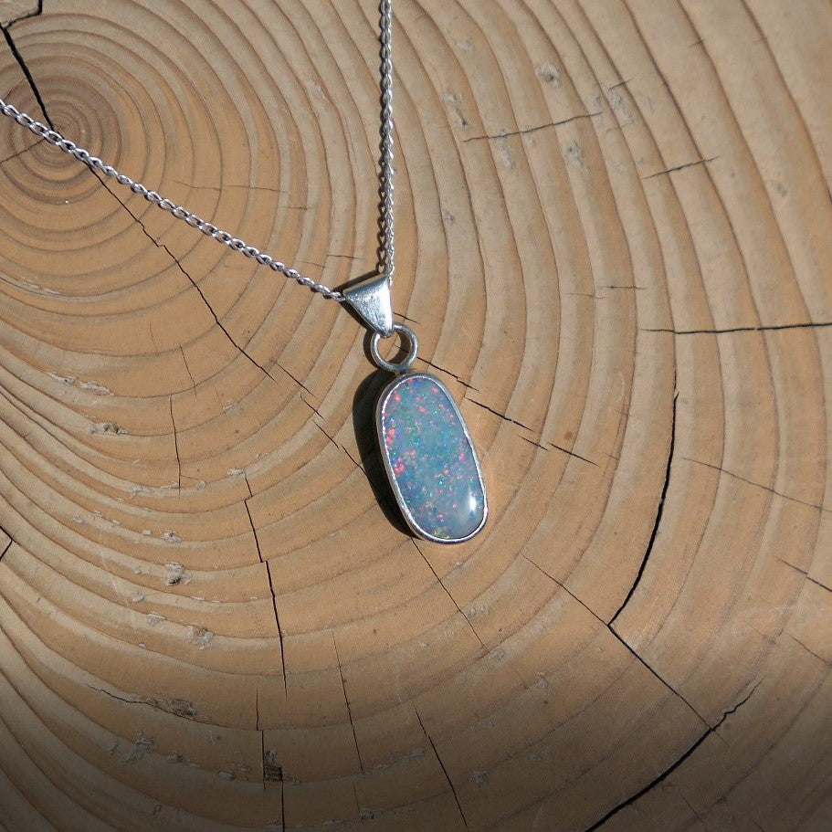 Silver opal pendant with a Coober Pedy doublet.