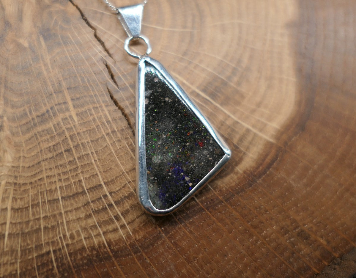 Double sided silver pendant with a Honduran matrix opal