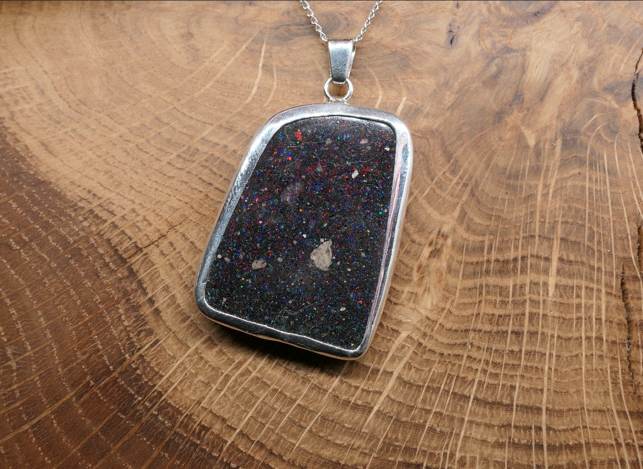 Double sided silver pendant with a Honduran matrix opal