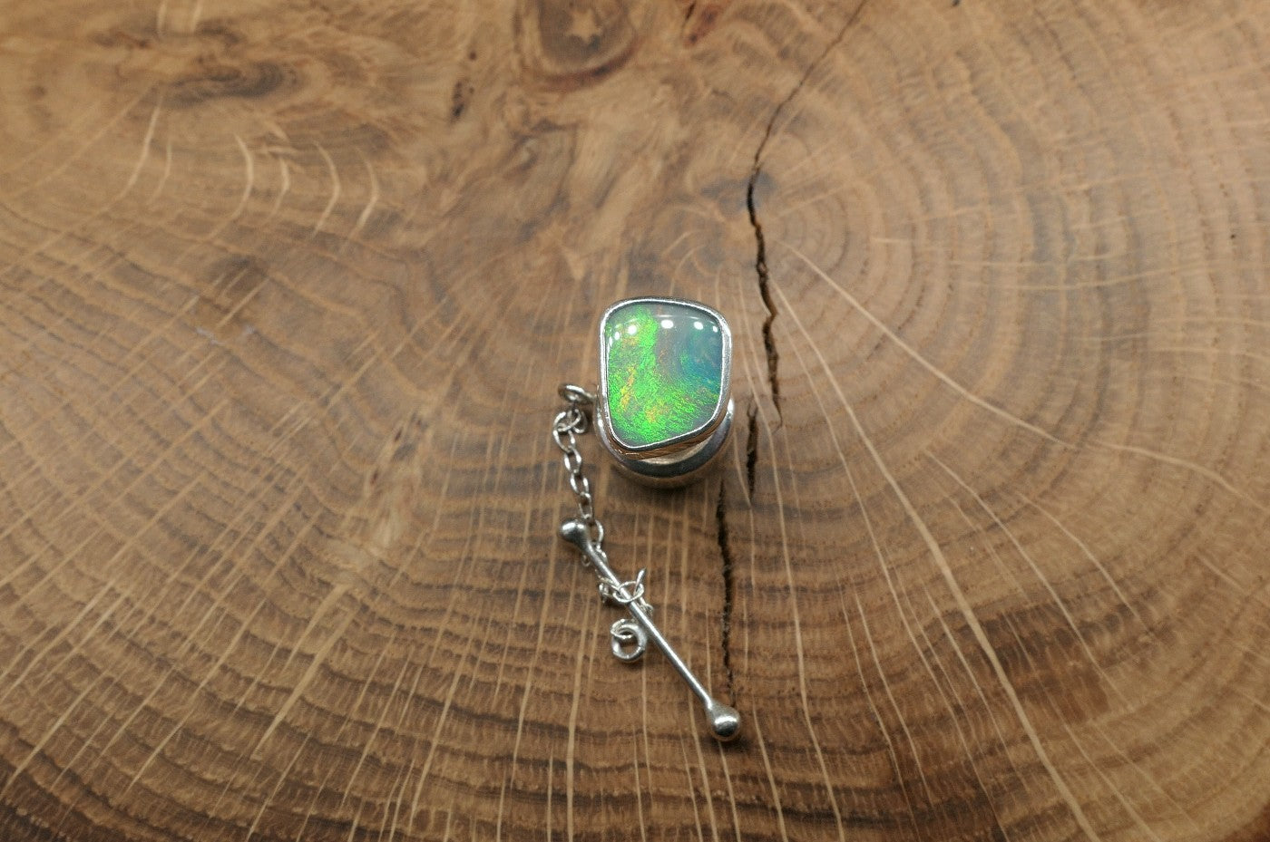 Silver tie tack with a Coober Pedy opal