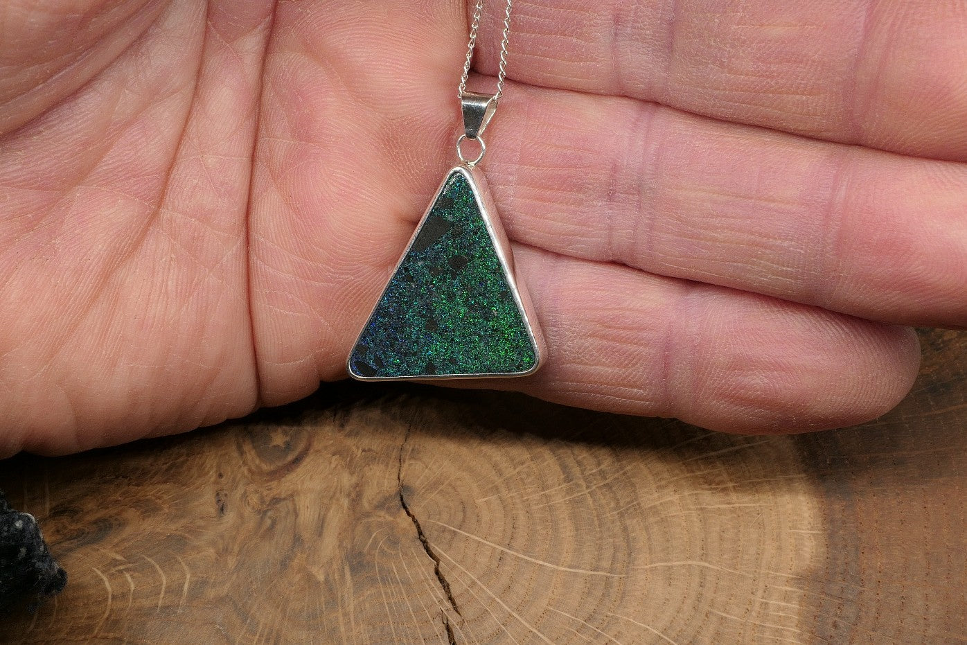 Silver opal pendant with an Andamooka matrix opal