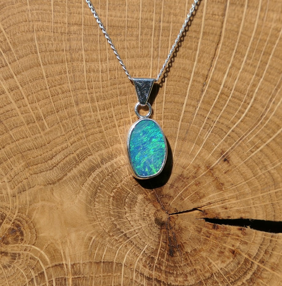 Silver opal pendant with a Coober Pedy doublet.
