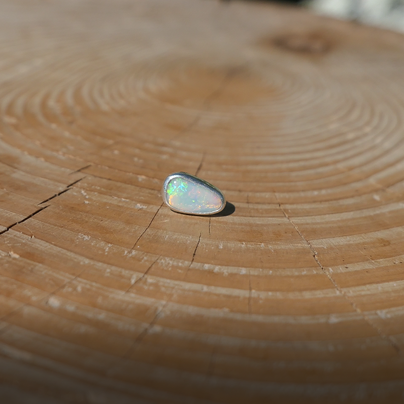 Silver tie tack with Coober Pedy solid opal.