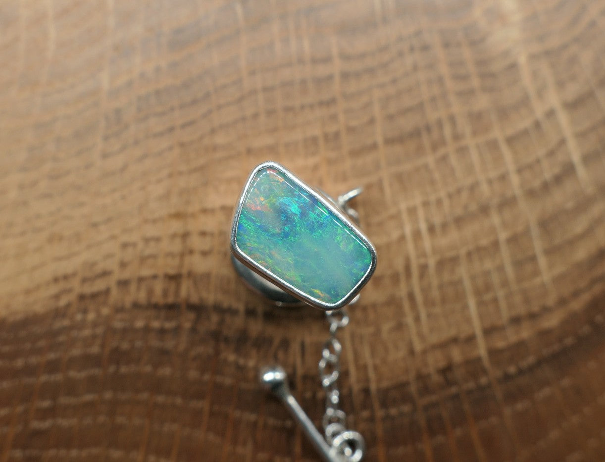 Silver tie tack with a Coober Pedy opal